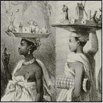 Women balancing round trays of goods on their heads