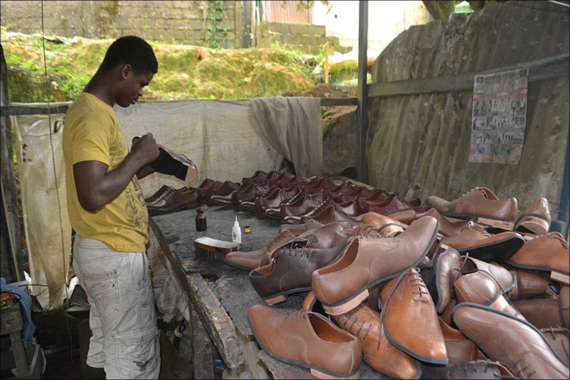 Craftsman shoemaker making handmade shoes