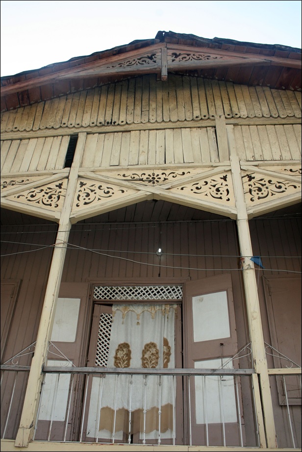 A gable roof with decoration and door