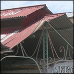 Shops with metal roofs and ironwork designs