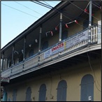 Two-story corner building with wrap around balcony