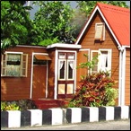 Chattel house with red roof